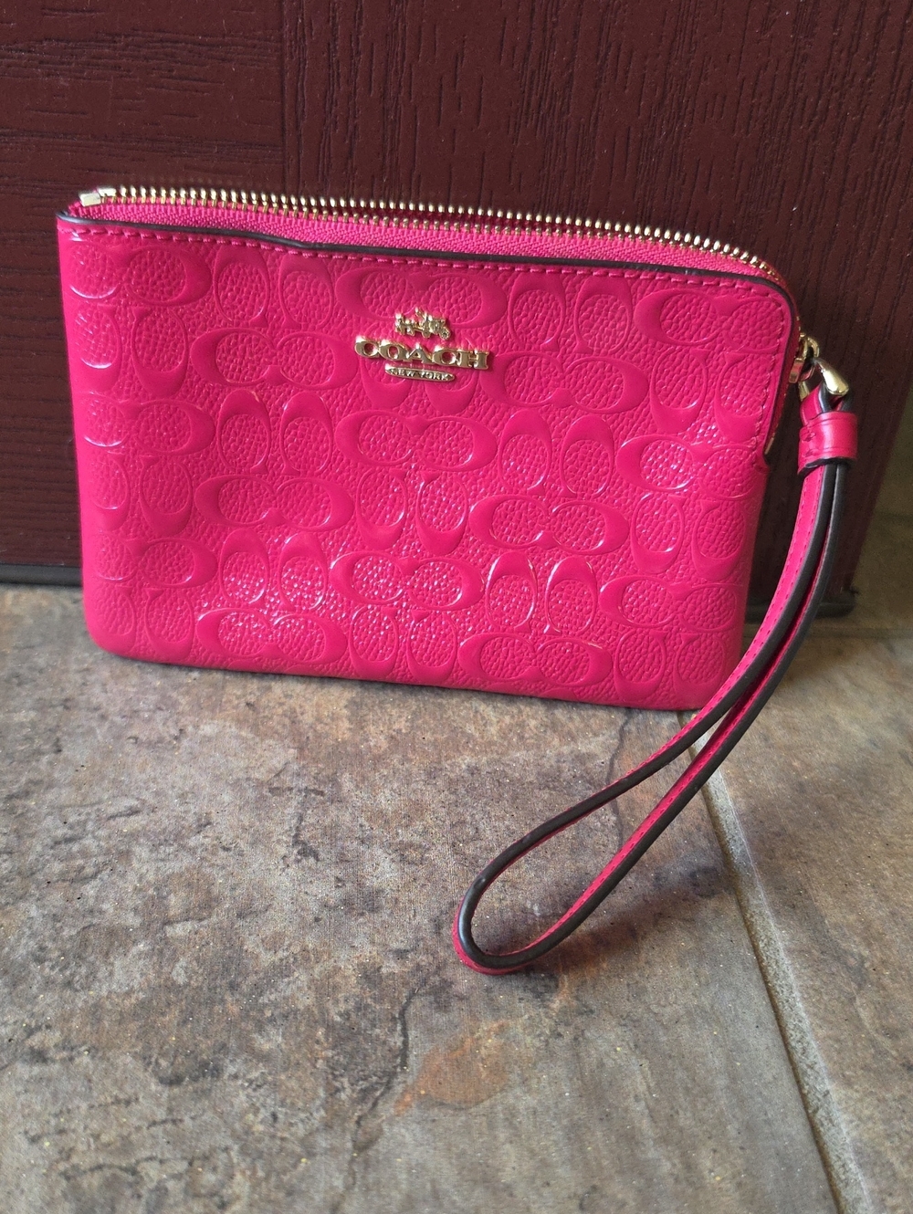 Coach Pink Signature Embossed Leather Wristlet